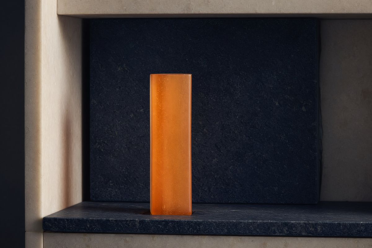 Abstract orange bar on navy stone — a score of published terms, not a star rating.